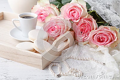 Morning breakfast in bed on a tray with coffee, pancakes, raspberries and a rose Stock Photo