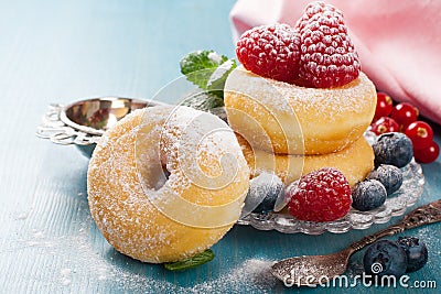 Morning breakfast with mini donuts and berries Stock Photo