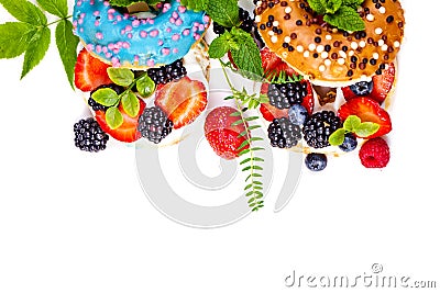 Morning breakfast with mini donuts and berries on plate under powdered sugar on white background. Tasty donuts closeup. Donuts cut Stock Photo