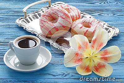 Morning breakfast with spring tulips and silk shawl on table Stock Photo