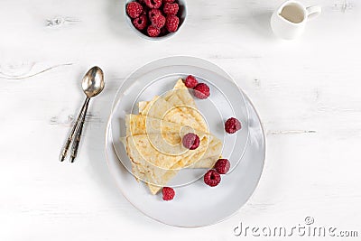 Morning, breakfast - traditional russian blini pancakes, french crepes served with fresh raspberries, coconut Stock Photo