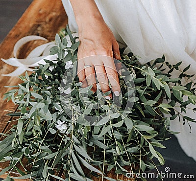 Morning of the bride with a bouquet of eucalyptus Stock Photo