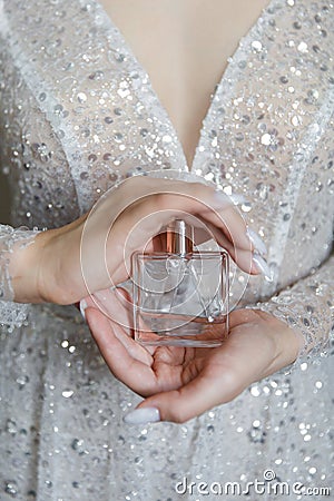 Morning bride perfume in hands Stock Photo