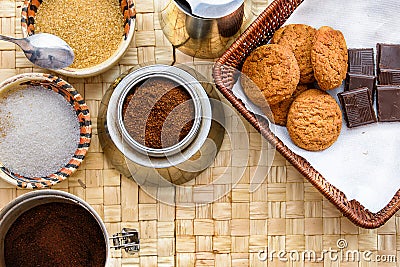 Morning coffe table with sugar, chocolate and biskits Stock Photo