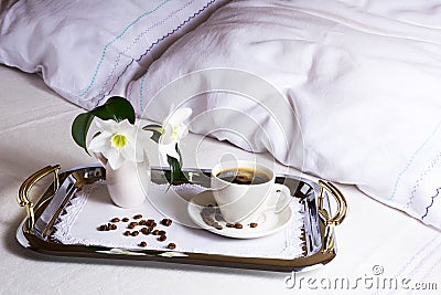 Morning coffee in bed on elegant silver serving tray Stock Photo