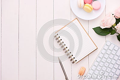 Morning cup of coffee, cake macaron, gift or present box and flo Stock Photo