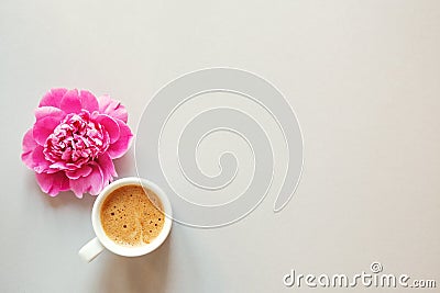 Cup of coffee and fresh beautiful spring pink peony flower on light background, top view, flat layout, copy space Stock Photo