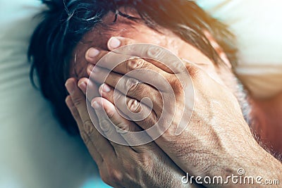 Morning depression and midlife crisis with man in bed Stock Photo