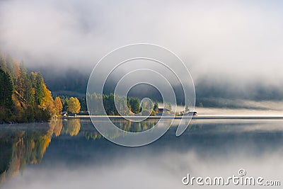 Morning fog at lake plansee Stock Photo