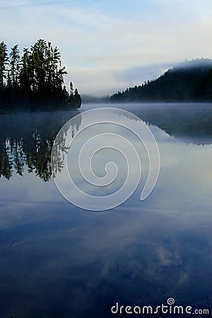 Morning Fog Rising on Lake Stock Photo