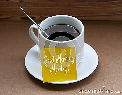 Morning greetings text on yellow notepad on coffee cup - Good morning Monday Stock Photo