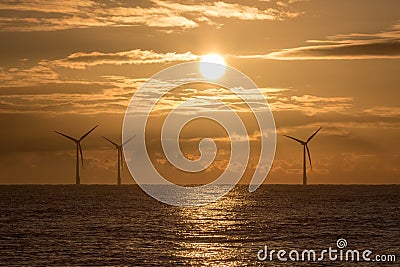 Morning has broken. Offshore wind farm sunrise beautiful background image Stock Photo