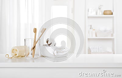 Morning hygiene products on white table top of defocused bathroom Stock Photo