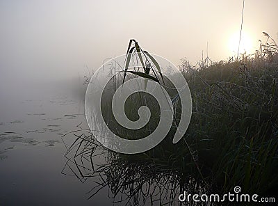 Morning lake in fog Stock Photo