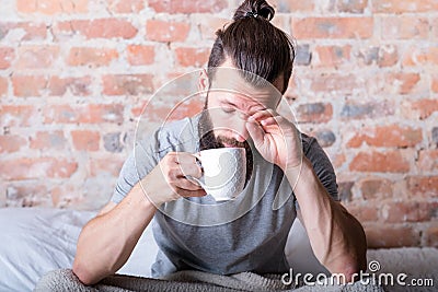 Morning laziness man bed sleepy eyes cup Stock Photo