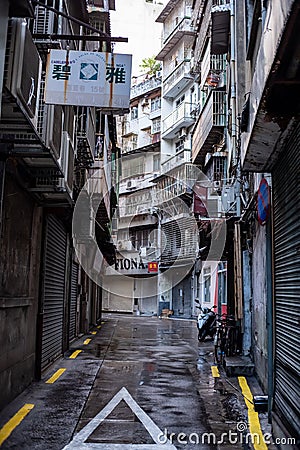 China, Macao street front photo in the morning of old buildings in one of the tidiest areas in Macao. photo of curved street Editorial Stock Photo