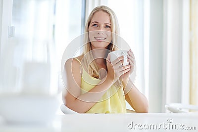 Morning musings. an attractive young woman drinking a coffee at home. Stock Photo