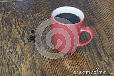 The morning pink cup of coffee on the table Stock Photo