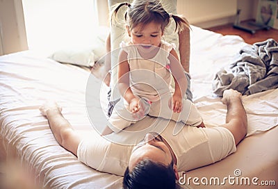 Morning play with my daddy. Little girl. Stock Photo