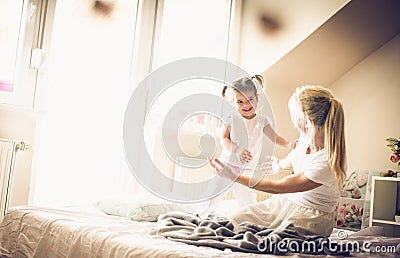 Morning playing. Mother and daughter. Stock Photo