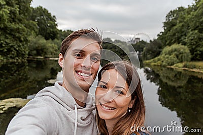 Young couple taking a selfie at park in London Stock Photo