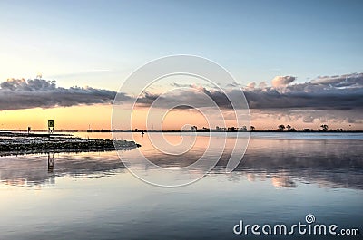 Morning sky reflecting in the estuary Stock Photo