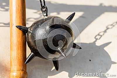 Morning Star, a medieval weapon made of a heavy iron ball with spikes, which is attached to a wooden stick by a chain Stock Photo