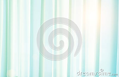 The morning sun shines with a translucent light green curtain for use against a background. The seamlessly fitted curtains are ver Stock Photo