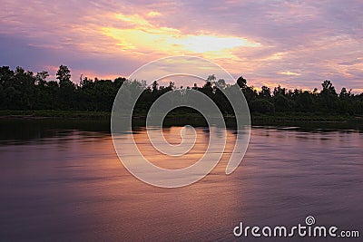 Morning. Sunrise on the river. The sun hid behind the clouds. Stock Photo