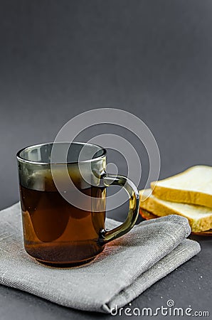 Morning tea and toast on a black background Stock Photo