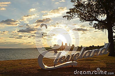 Morning view of Cleveland skyline, Lake Erie, and paraglider Editorial Stock Photo