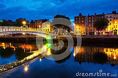 Morning view of famous illuminated Ha Penny Bridge in Dublin, Ireland Stock Photo