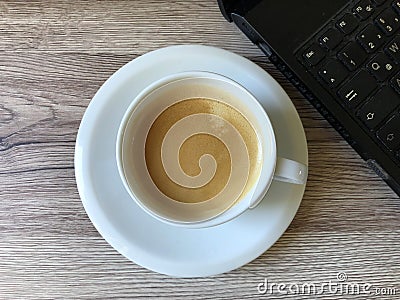 Laptop and fresh coffee. Stock Photo