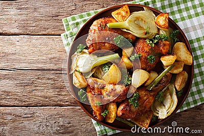 Moroccan food: pieces of chicken baked with fennel and potatoes Stock Photo