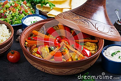 Moroccan food. Traditional tajine dishes, couscous and fresh salad Stock Photo