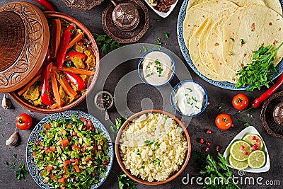 Moroccan food. Traditional tajine dishes, couscous and fresh salad Stock Photo