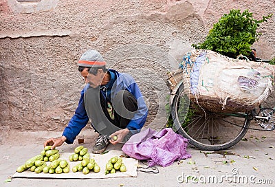 Moroccan Man Arranging his Vegetables for Sale Editorial Stock Photo