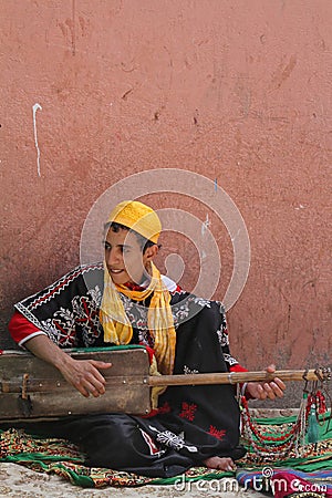 A moroccan musician in the streets of Marrakesh Editorial Stock Photo