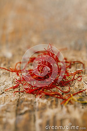 Moroccan saffron treads in pile, on wood Stock Photo