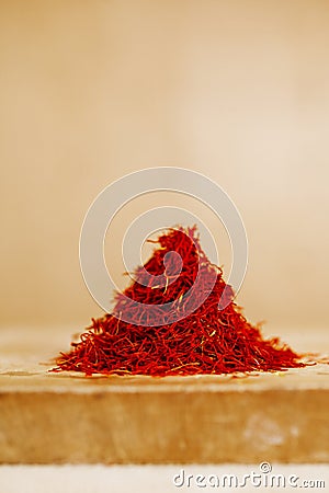 Moroccan saffron treads in pile, on wood Stock Photo