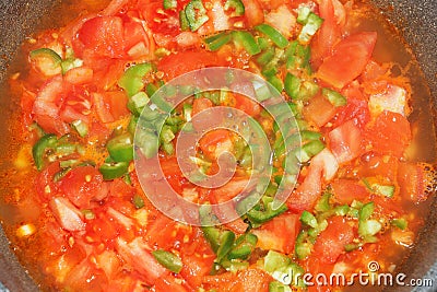 Matbucha, cooked tomatoes and garlic. Stock Photo