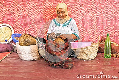 MOROCCO, AURIKA VALLEY - OCTOBER 24: Woman at work in a cooperative for manufacturing argan oil on 24th october in Morocco Editorial Stock Photo