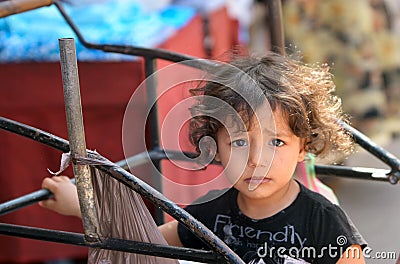 Moroccan girl on the street of old Medina of the city of Fes Editorial Stock Photo