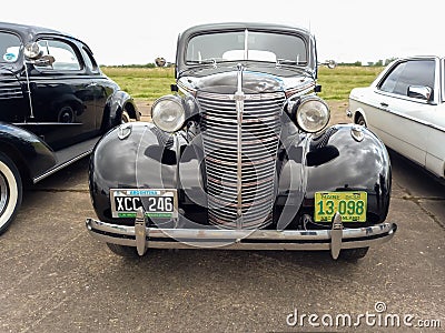 old black 1938 Chevrolet Chevy Master sedan by GM. CADEAA 2022 classic car show. Editorial Stock Photo