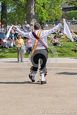 Morris dancer receives applause and adulation from crowd in English park Editorial Stock Photo