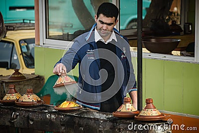 Morrocan man making tagine Editorial Stock Photo