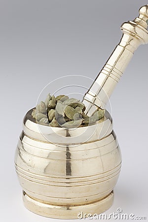 Mortar and pestle with Cardamom. Stock Photo