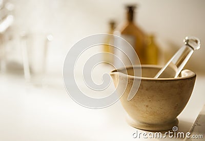 Mortar and pestle with drug vial and bottles Stock Photo