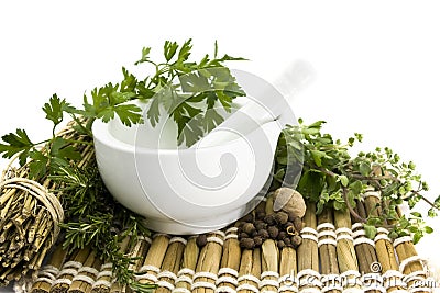 Mortar and pestle with herbs Stock Photo