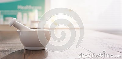 Mortar and pestle on the pharmacist`s table Stock Photo